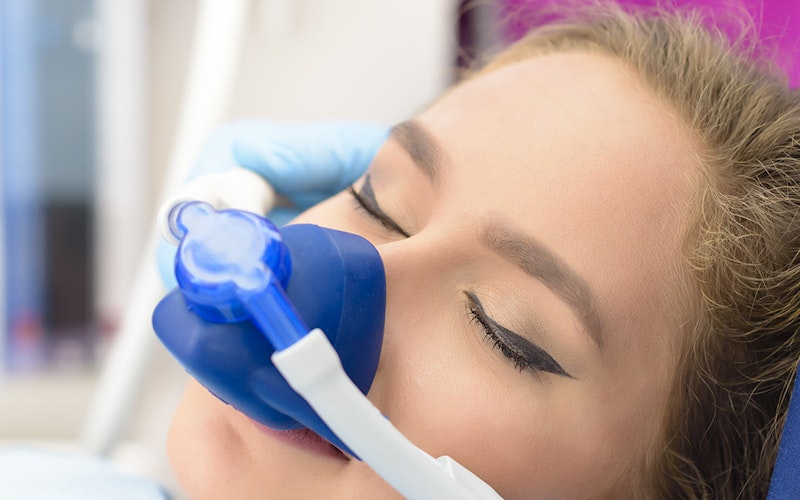 woman with nitrous oxide mask on