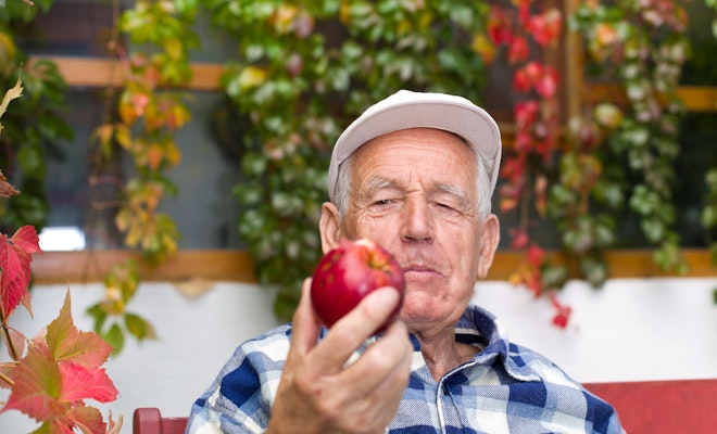 Senior eating an apple