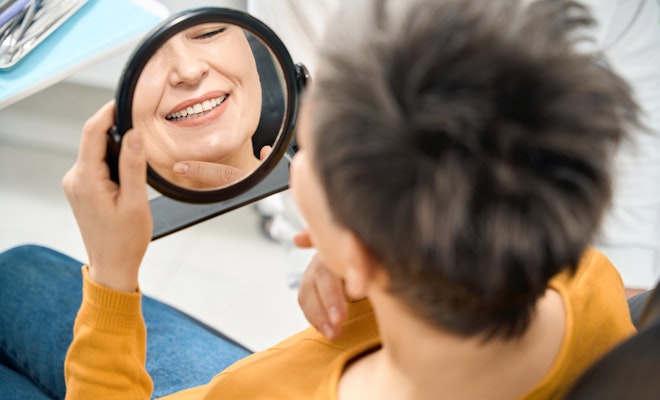 Senior woman smiling at the dentist