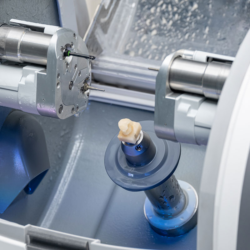 CEREC machine milling a crown