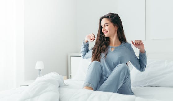 Young woman waking up rested