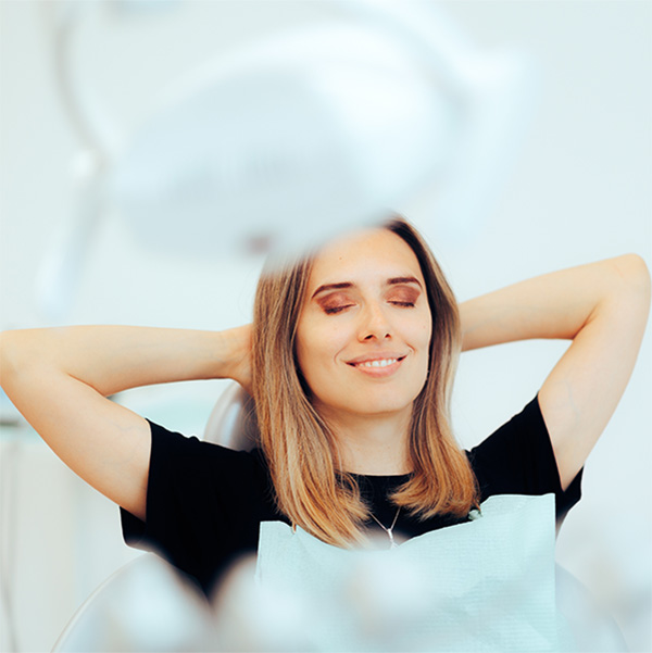 Young woman relaxing in a dental chair