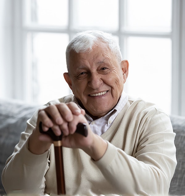 Smiling older man with same-day dental implants