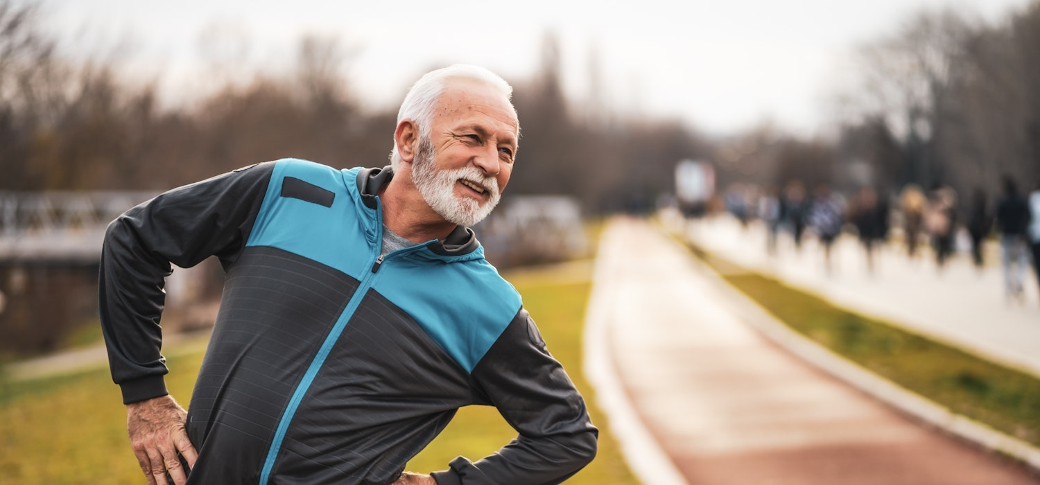 senior man stretching outside