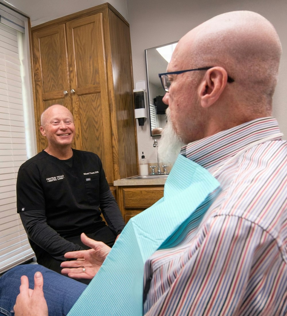 Dr. Michael J. Cooney talking to patient