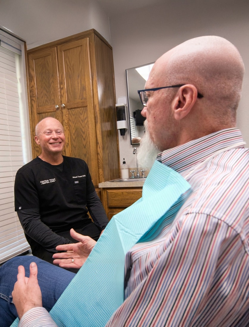 Dr. Michael J. Cooney talking to patient