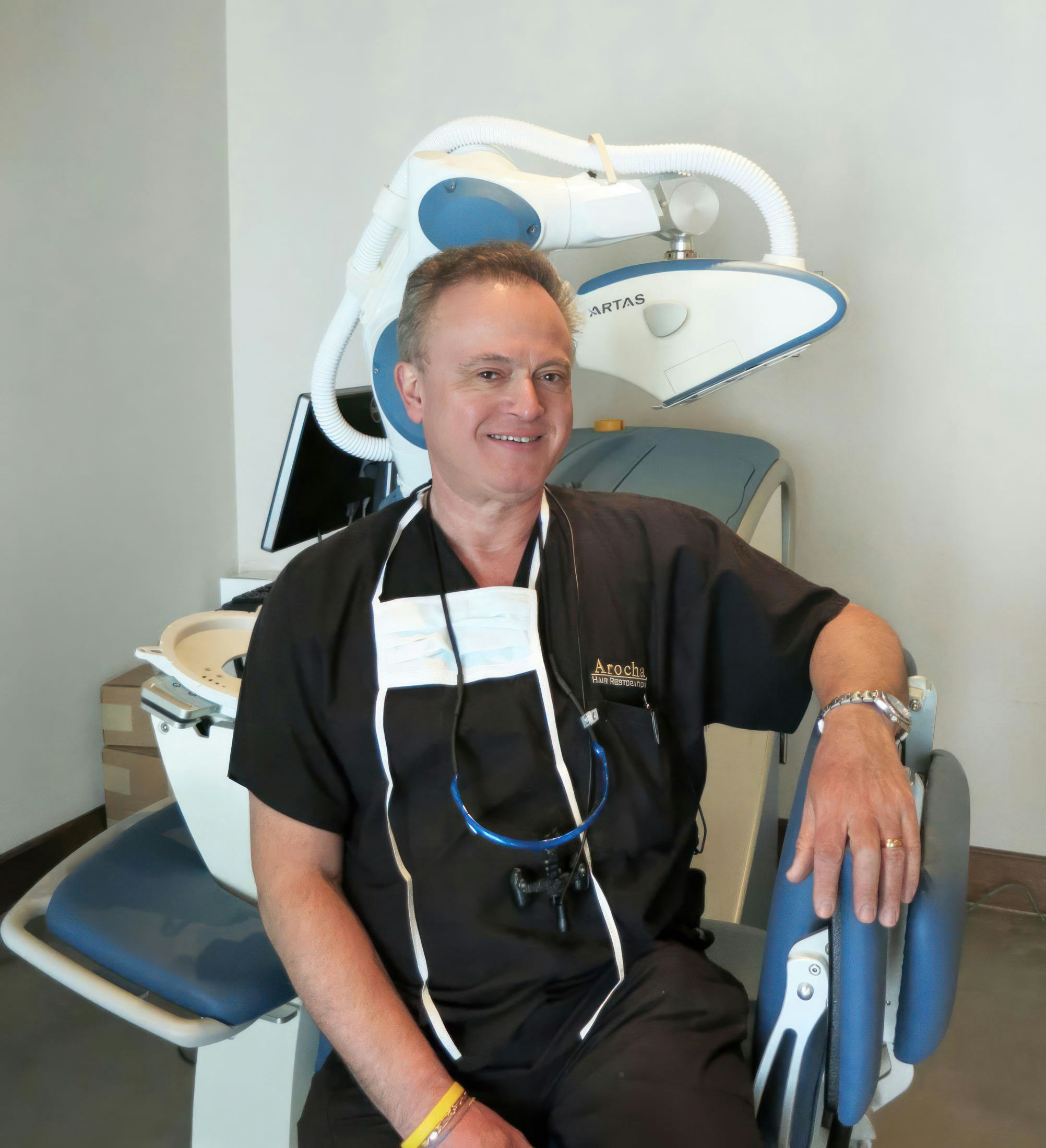 Dr. Arocha sitting on chair