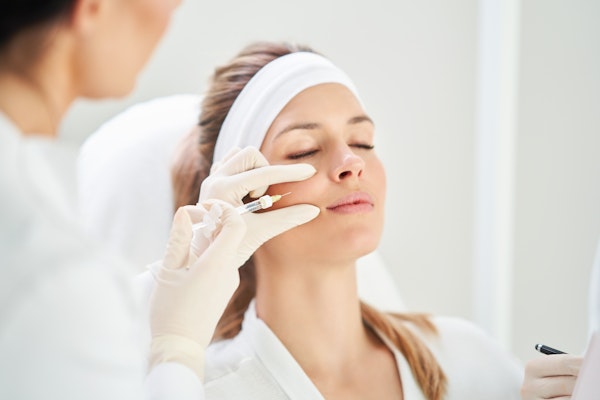 a woman receiving Botox injections
