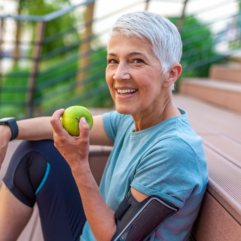 a woman eating an apple