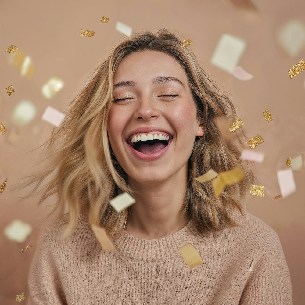 a joyful woman after a smile makeover with falling confetti