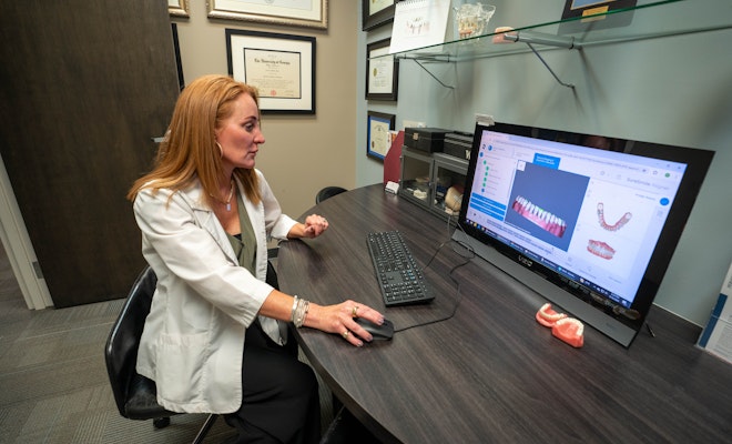 Staff looking at scans on a computer