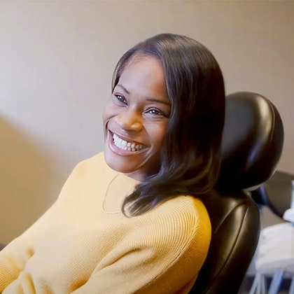 smiling woman in the dental chair