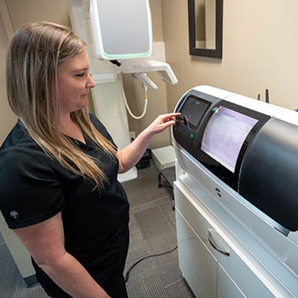 team member using our CEREC machine