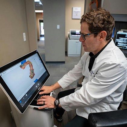 dentist working on a computer