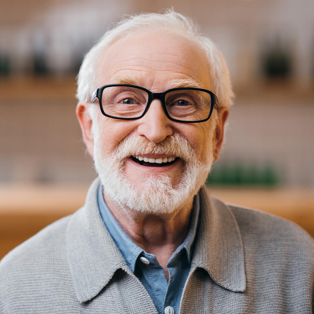 a mature man, smiling