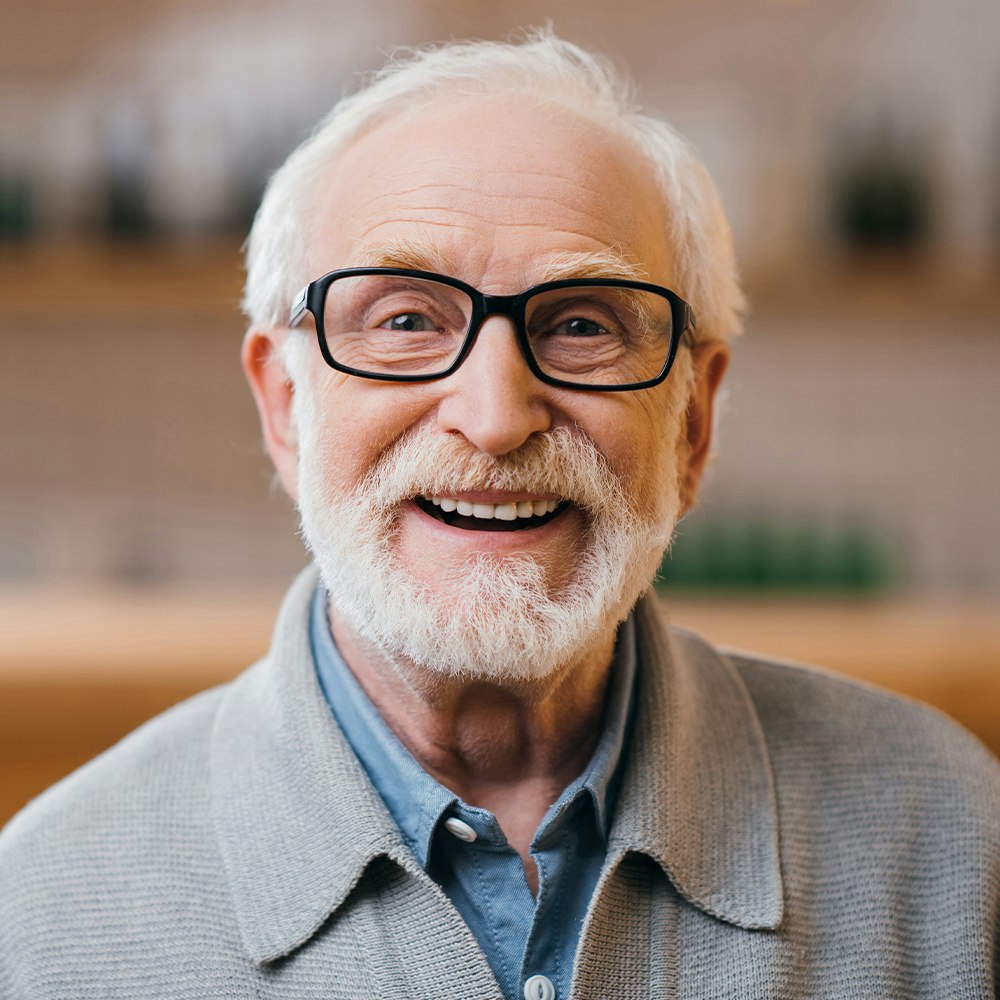 a mature man, smiling