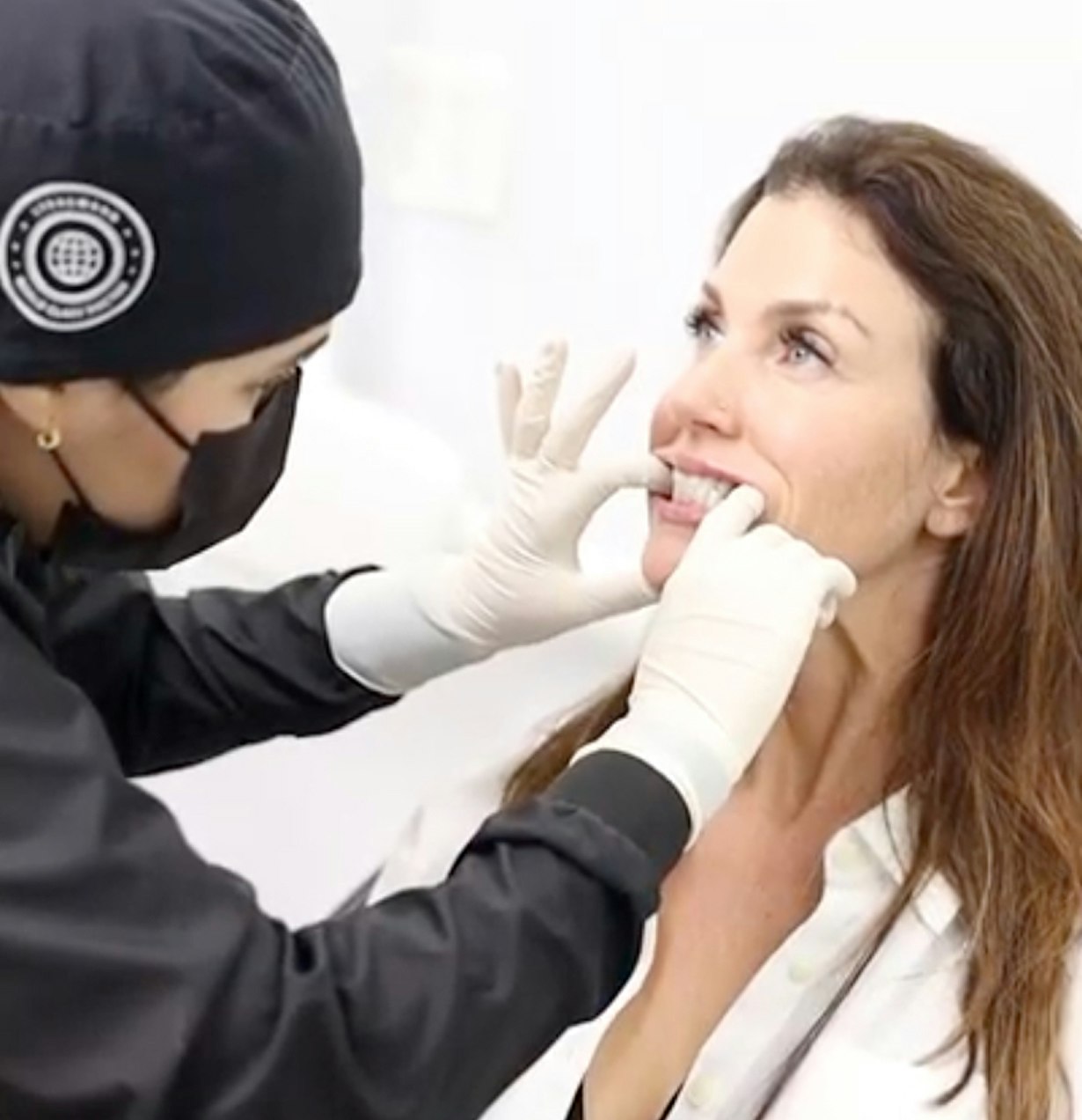 Woman having a denture fitted