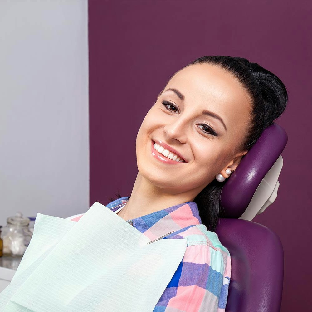 Woman smiling in a dental chair