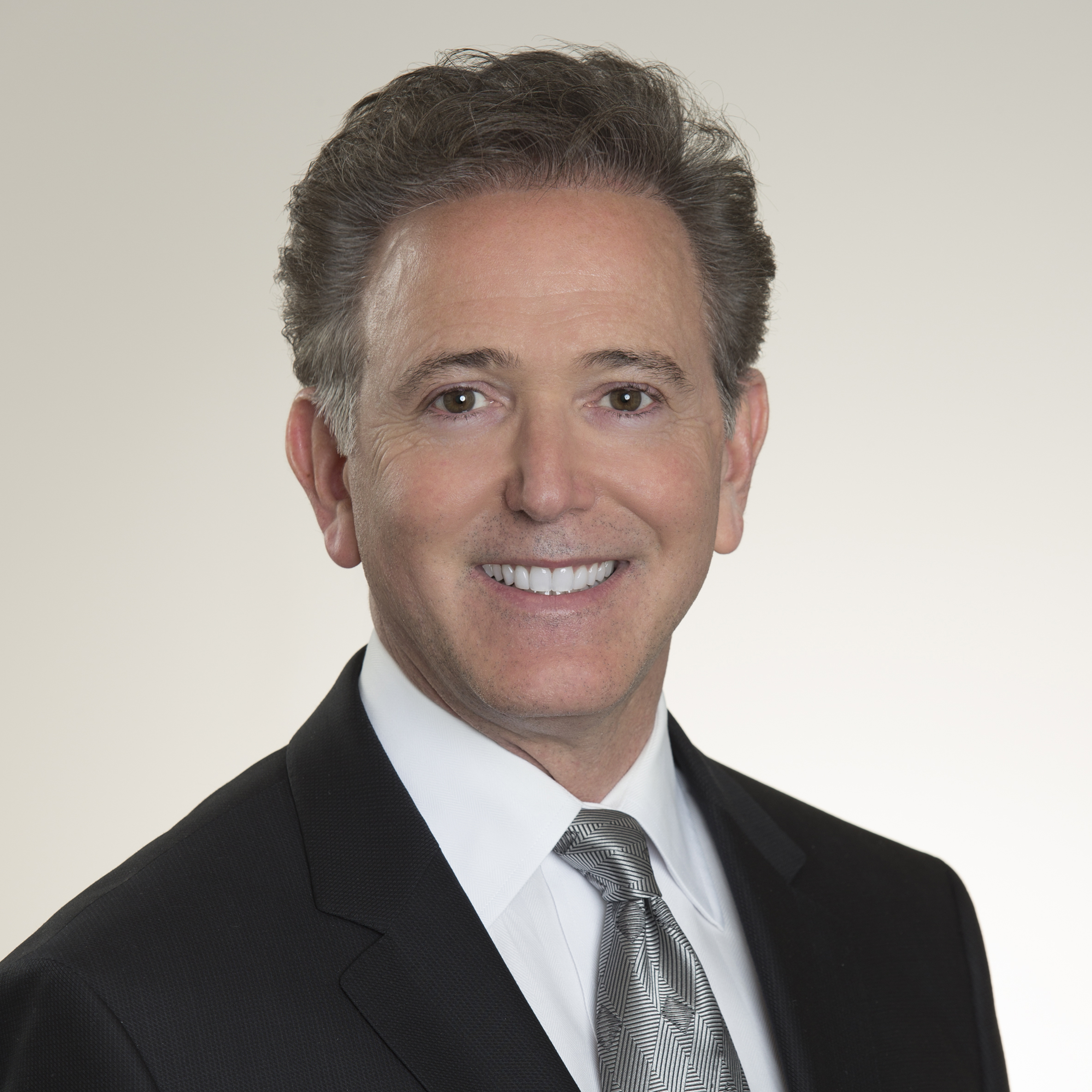 headshot of our dentist, Dr. Craig Goldin