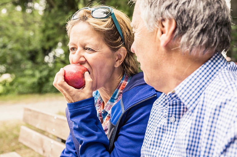 Woman biting apple