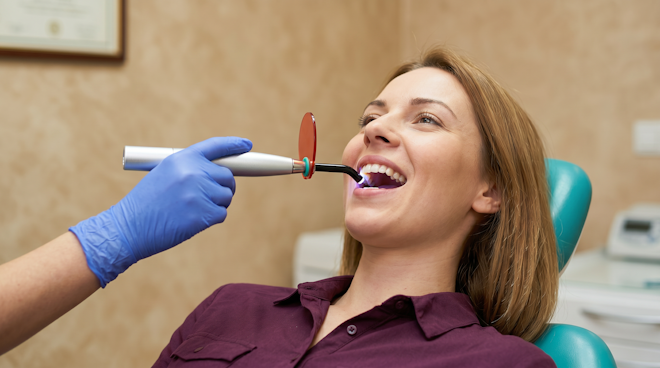 Woman undergoing dental bonding treatment