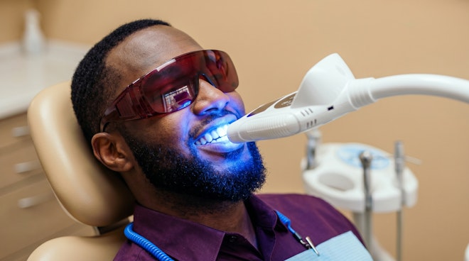 Man getting his teeth professionally whitened