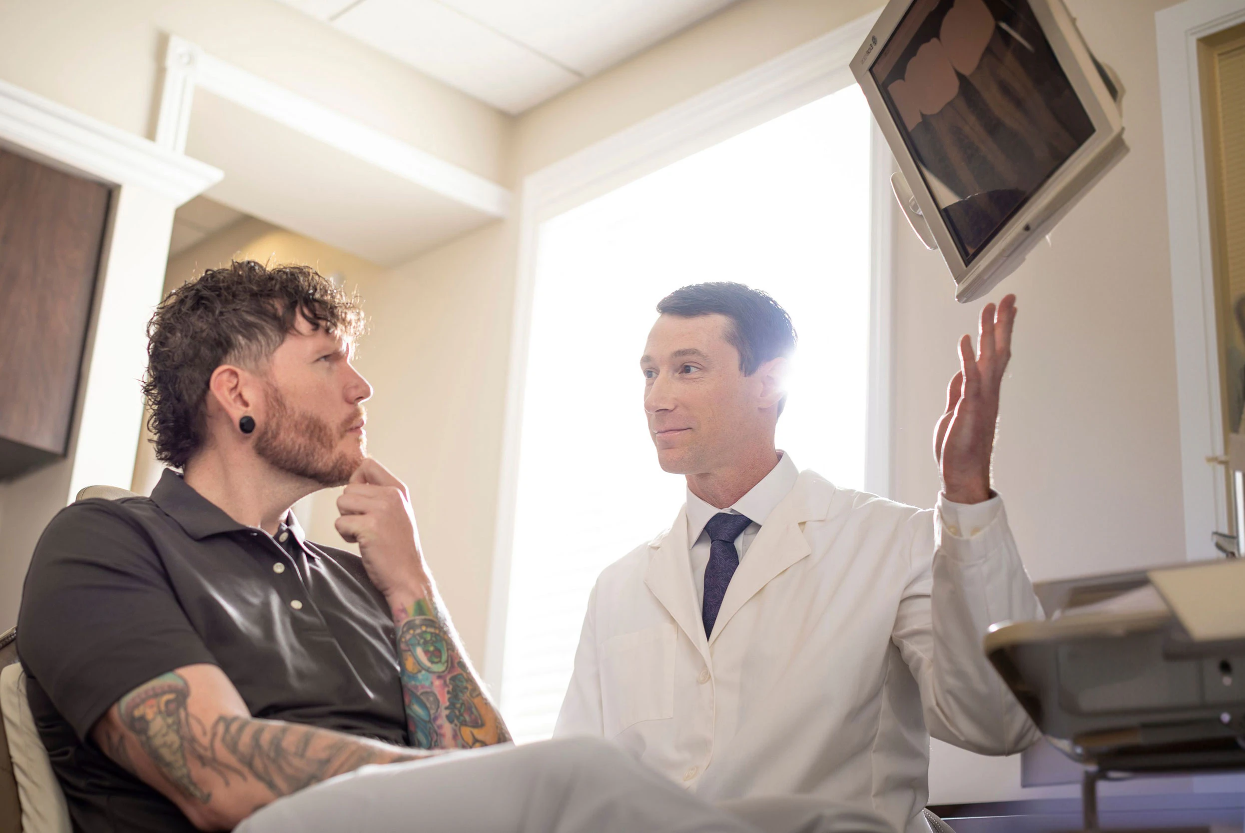 Dr. Whalen showing patient an x-ray
