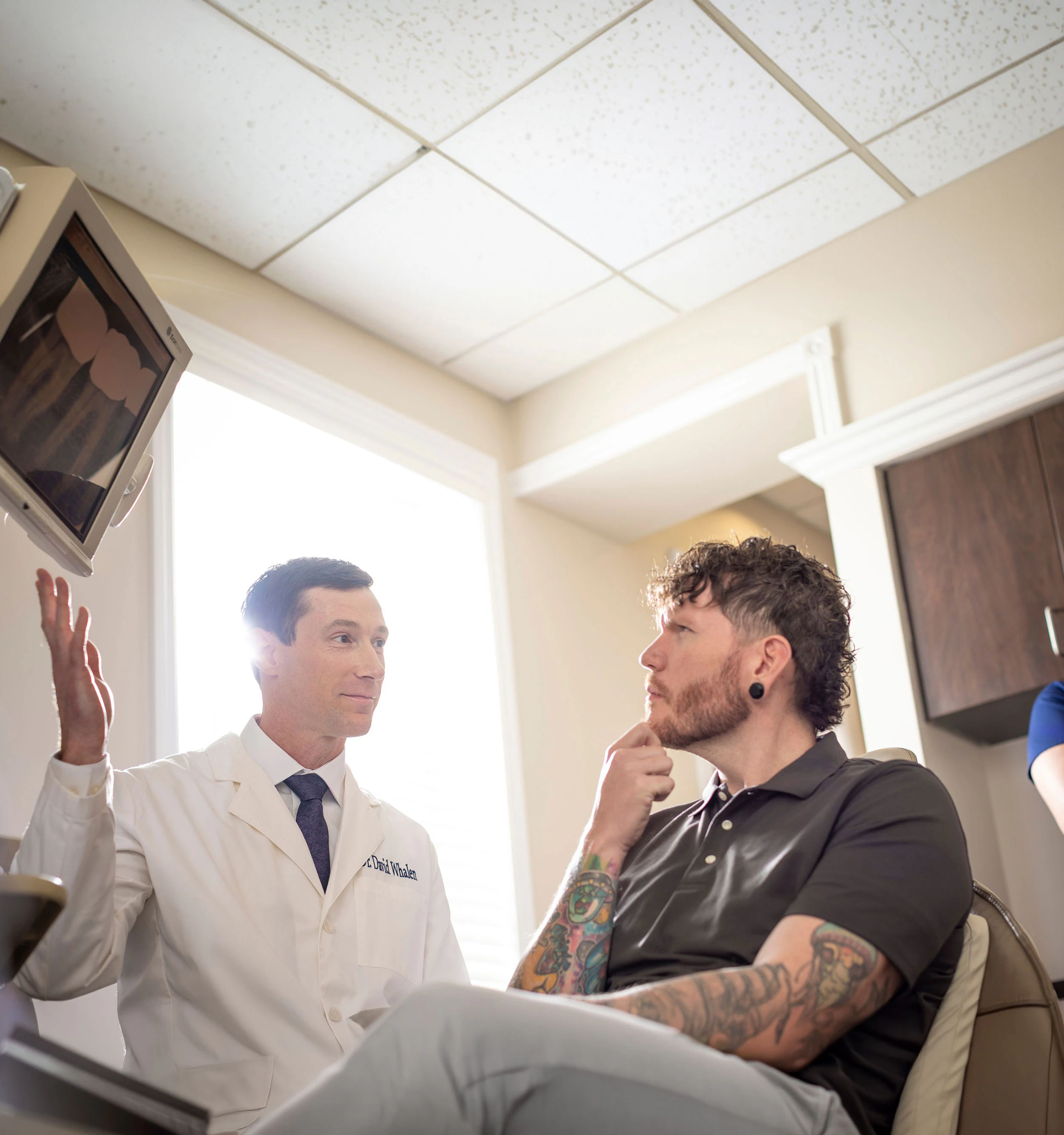 Doctor reviewing x-rays with patient
