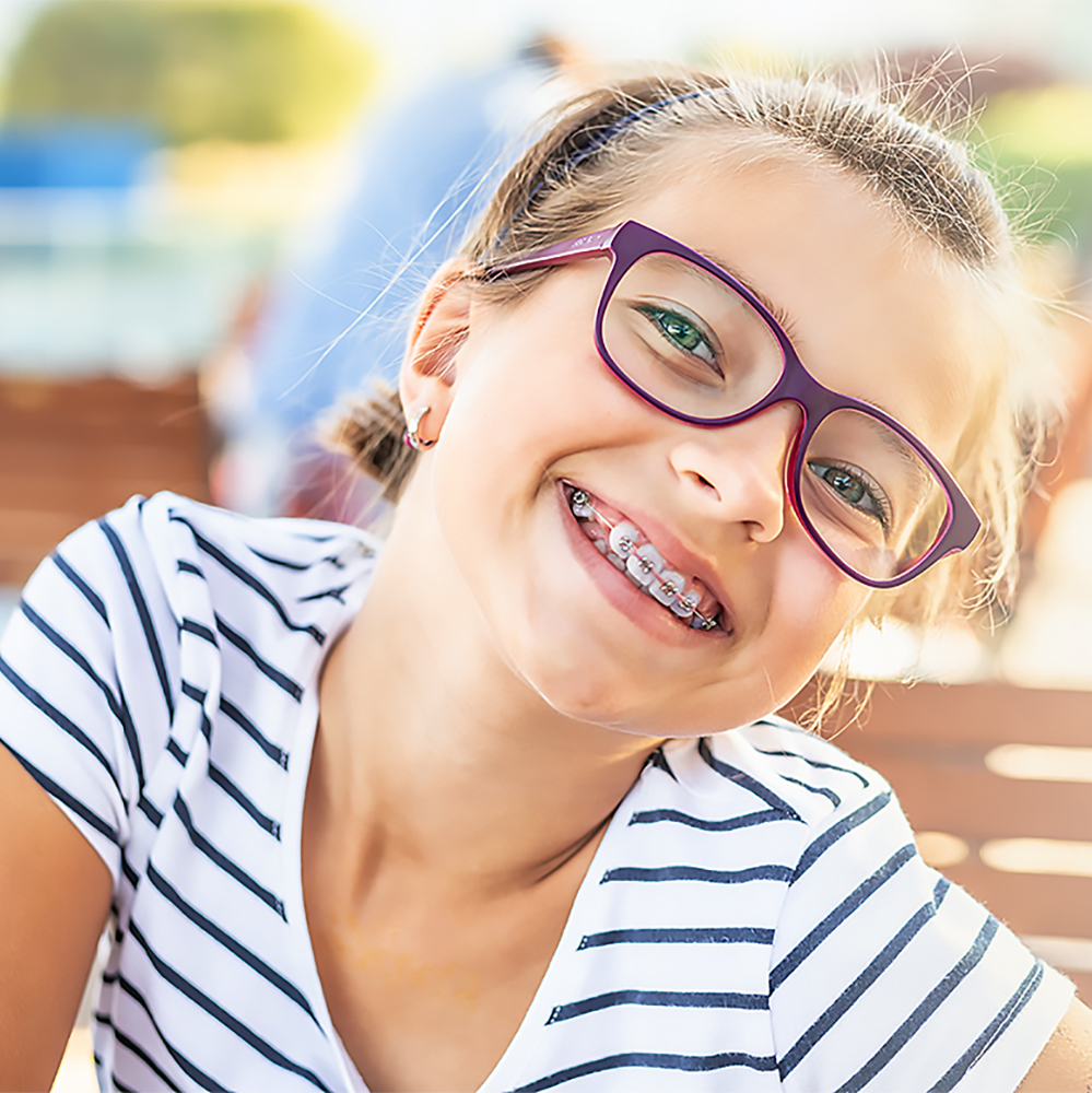 Young girl smiling with braces