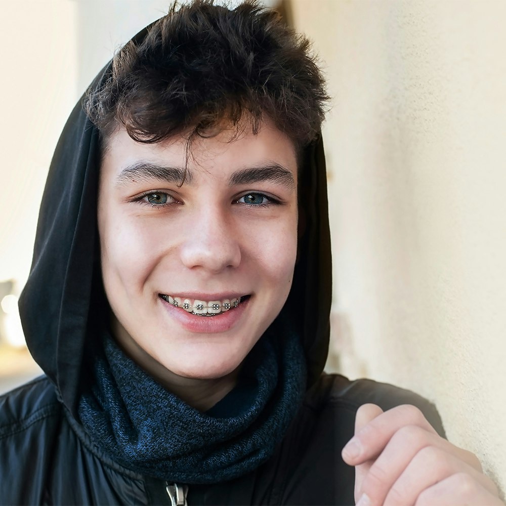 Young boy smiling with braces