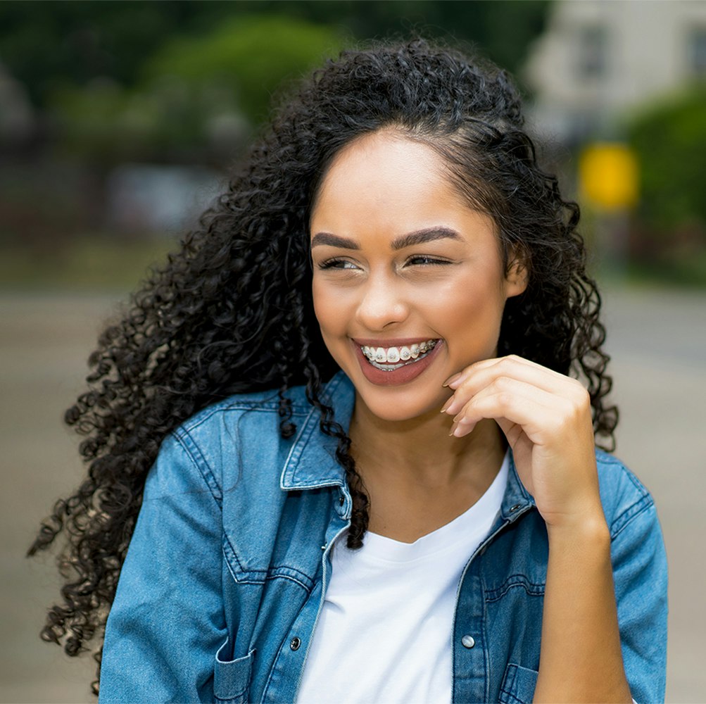 Young girl smiling with braces