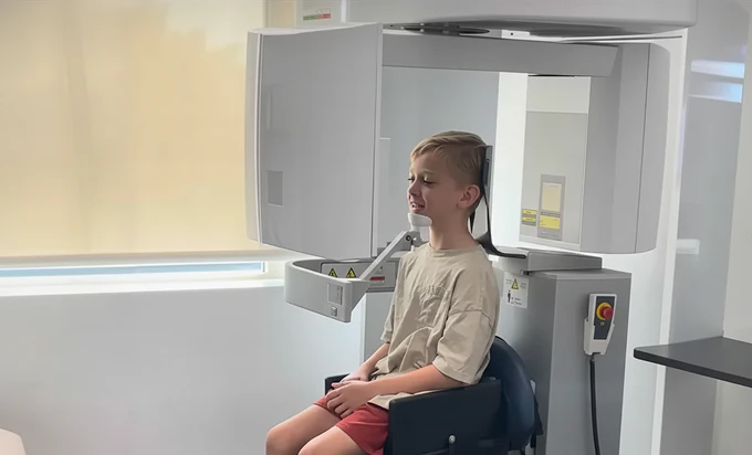 Dr. Hau examining a patient