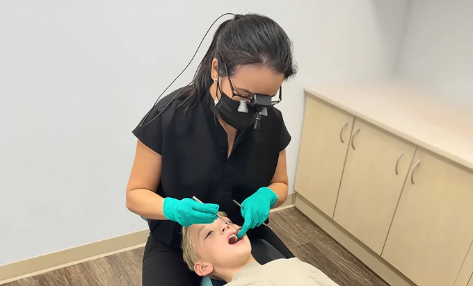 Dr. Hau examining a patient