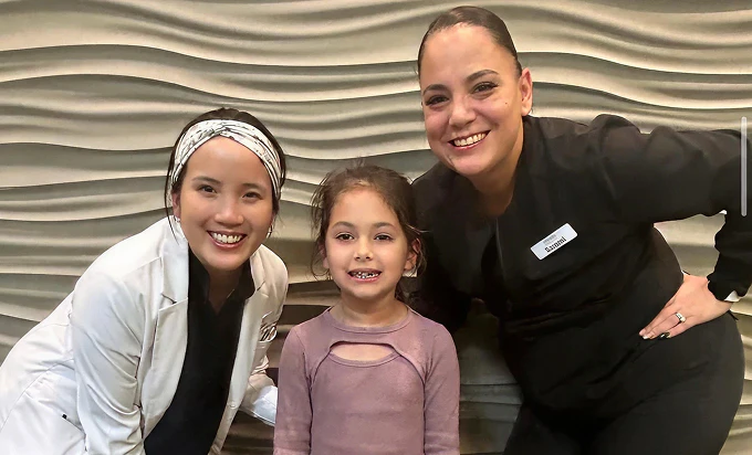 Dr. Hau and staff with patient