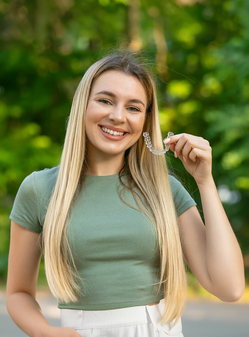 girl with clear aligners