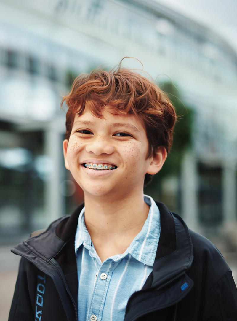 child smiling with braces