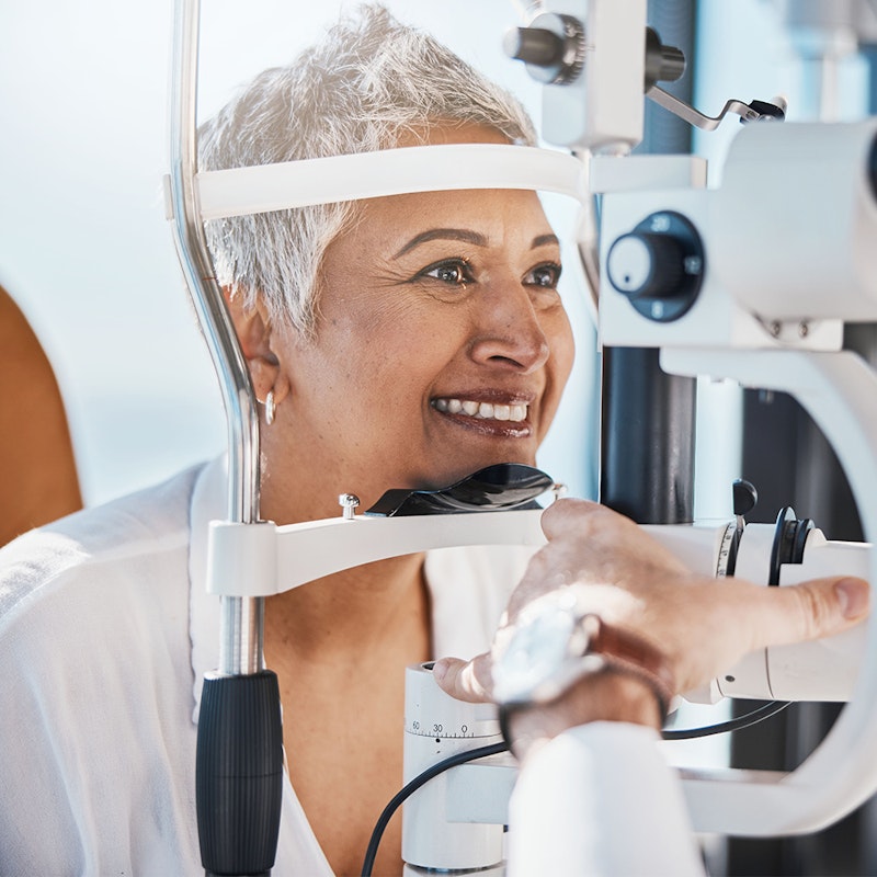 Excited woman getting eye examined