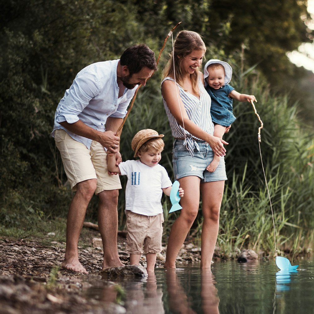 a family enjoying a pond