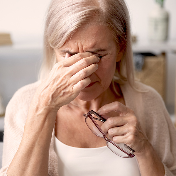 Woman rubbing eyes