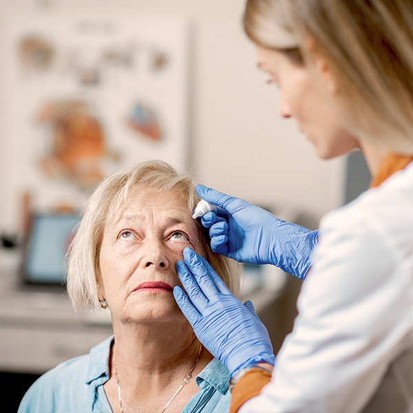 Cataract patient getting eye drops