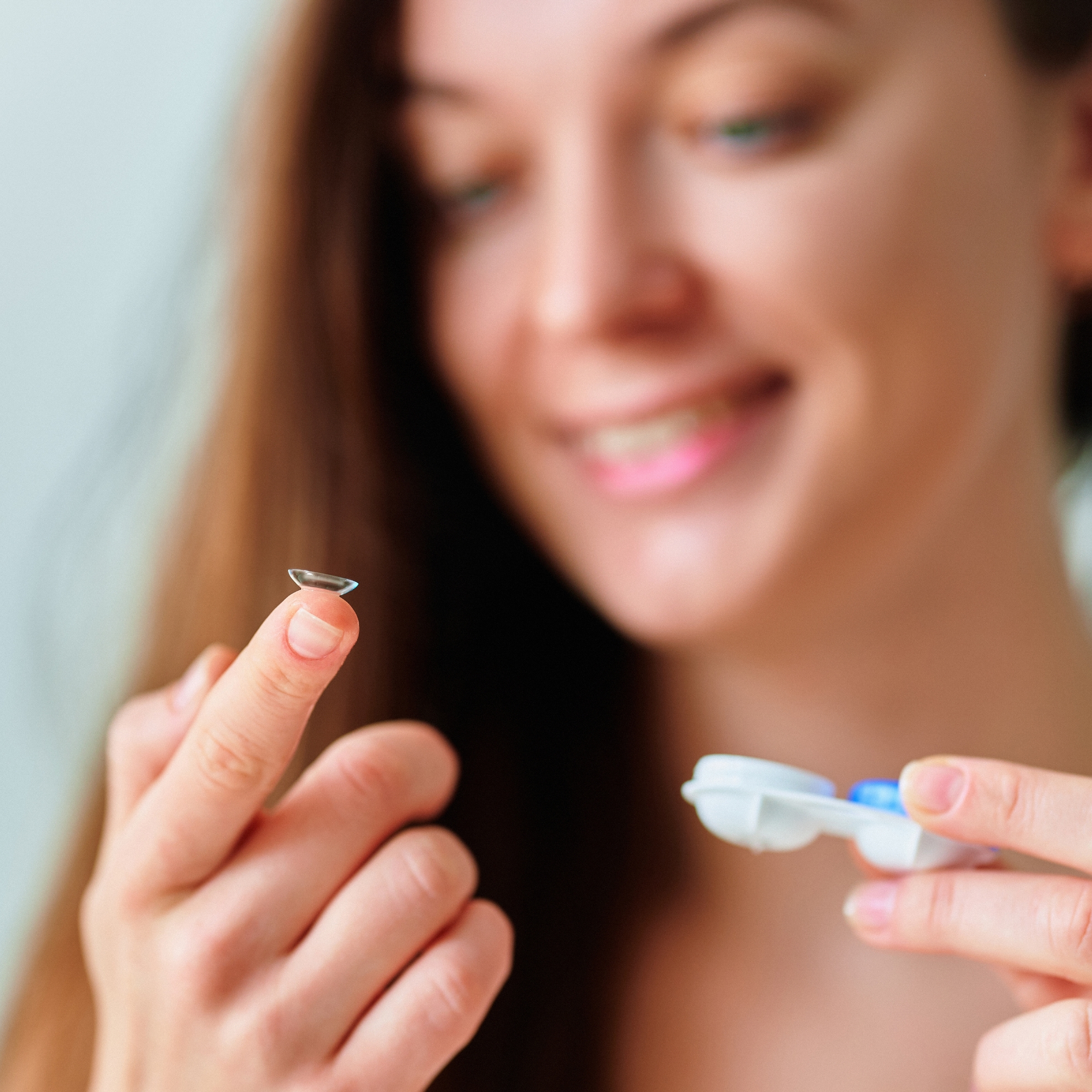 contact at the tip of woman's finger
