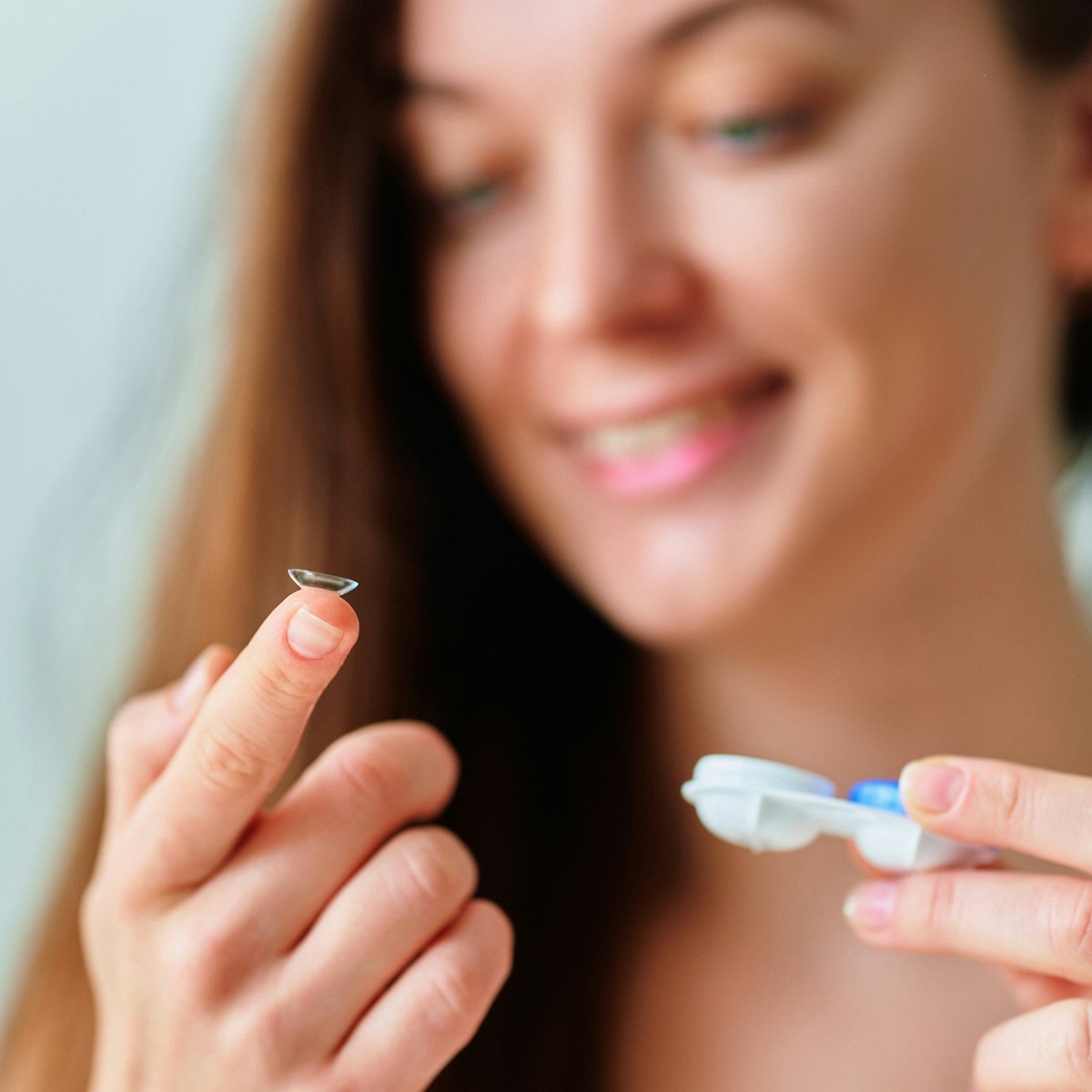contact at the tip of woman's finger