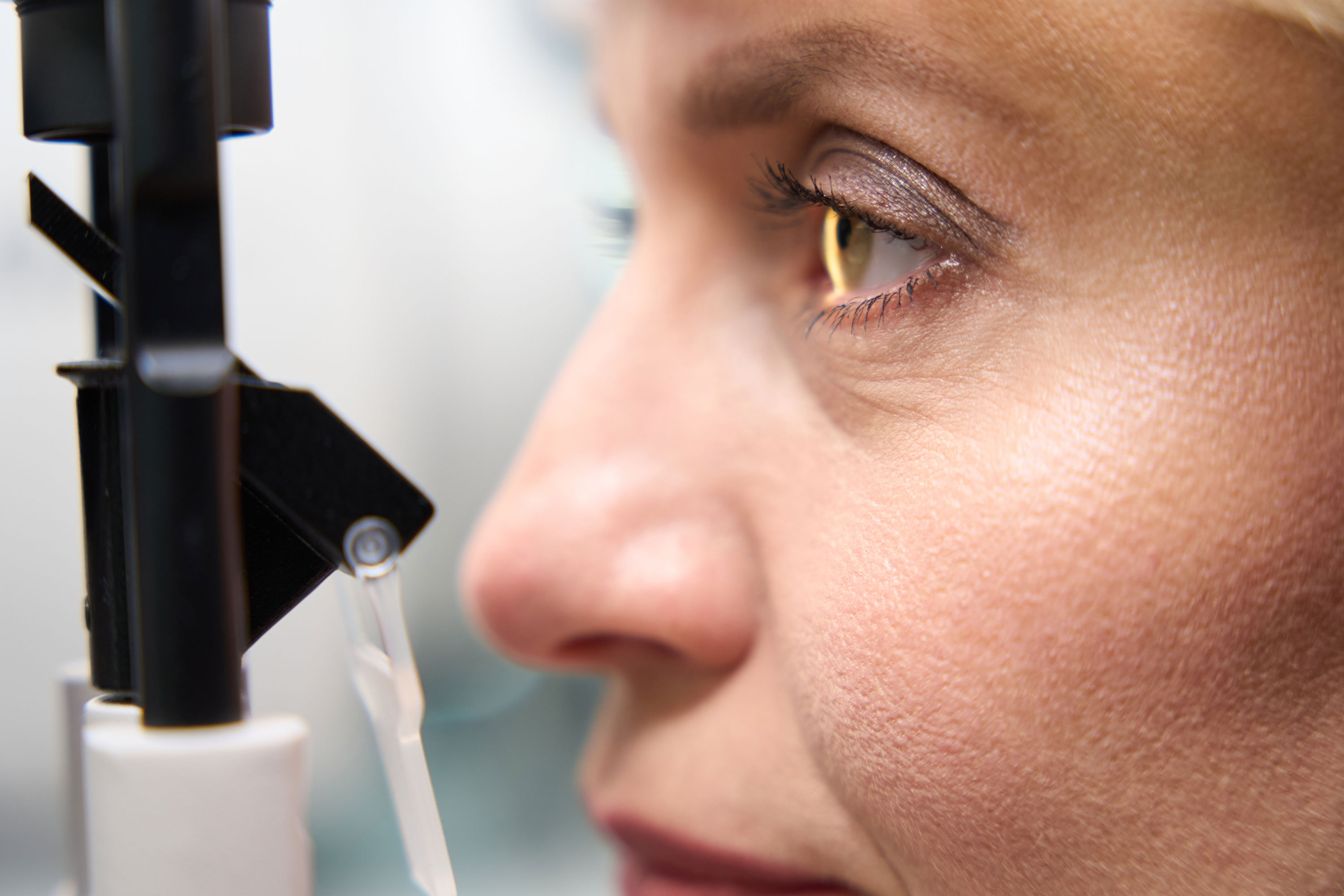 Woman having her eye examined