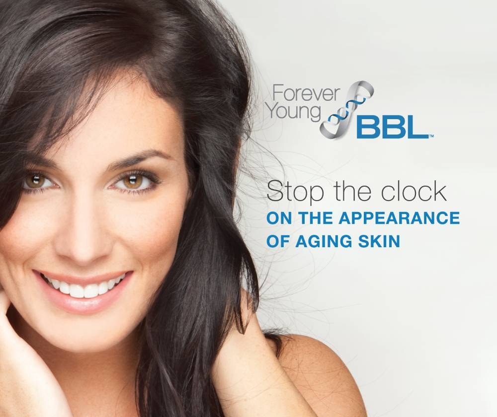 stock image of a female model smilimg by holding hands on face - Forever young bbl