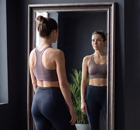 Woman checking her reflection in a mirror