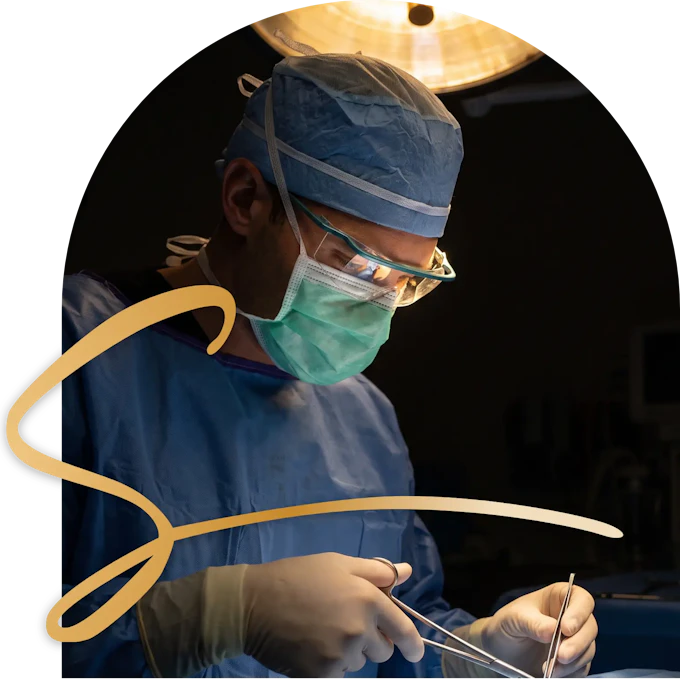 Dr. Brown closing an incision with fine sutures in the operating room