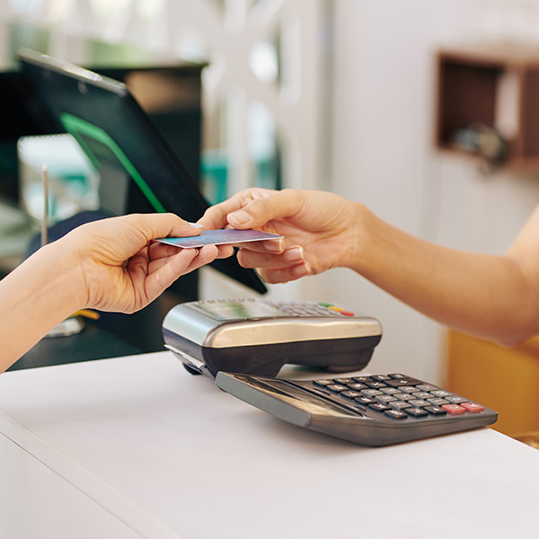 Denton microneedling patient paying for services at counter