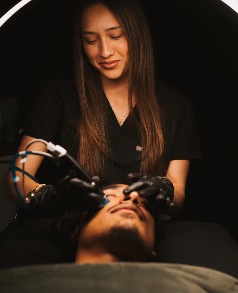 Medical Aesthetician performing facial