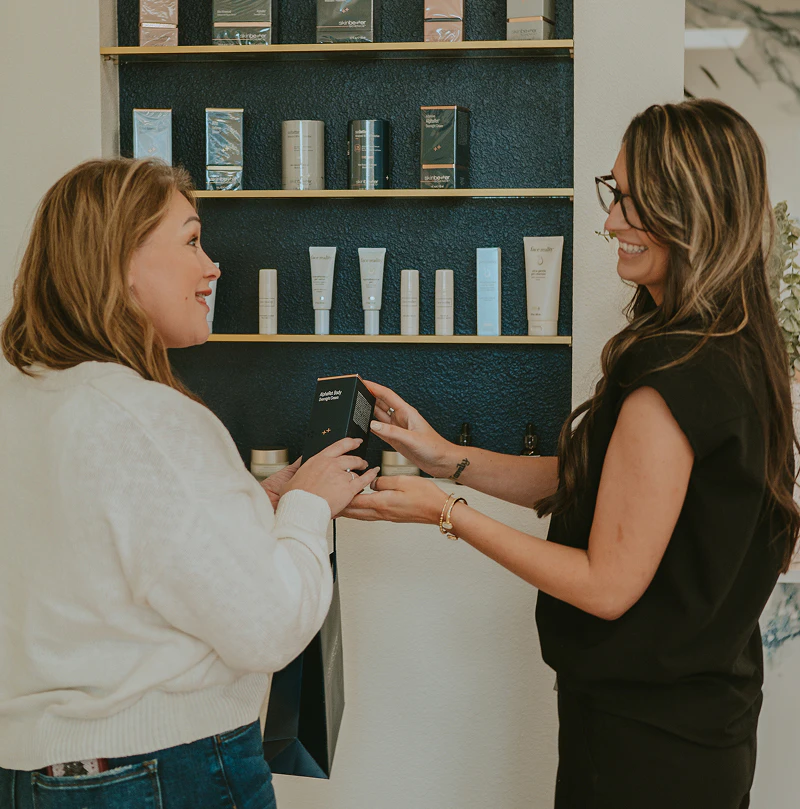 med spa staff member discussing skincare products