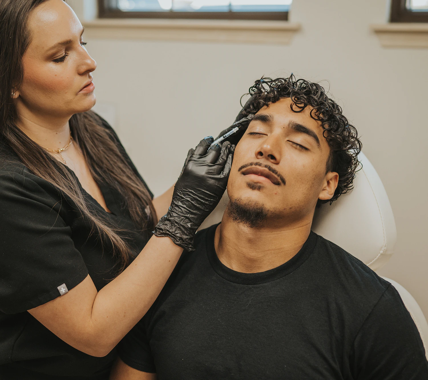 Man receiving botox injection